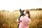 woman and young Border Collie