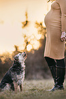 pregnant woman and Border Terrier