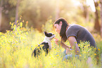 woman and Boston Terrier