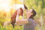 woman and Boston Terrier