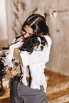 young woman with Cavalier King Charles Spaniel