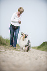 woman and longhaired Collie