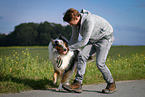 man and longhaired Collie