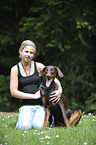 girl with Doberman Pinscher