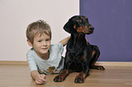 boy with Doberman Pinscher