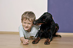 boy with Doberman Pinscher