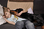 boy with Doberman Pinscher