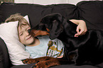 boy with Doberman Pinscher