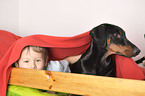 boy with Doberman Pinscher