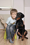 boy with Doberman Pinscher