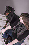 woman and Doberman Pinscher