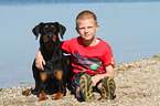 Boy and Doberman Pinscher