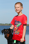 Boy and Doberman Pinscher