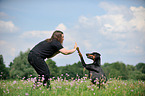 woman and Doberman Pinscher