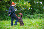 woman and Doberman Pinscher