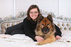 woman and Eurasian Dog
