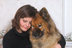 woman and Eurasian Dog