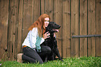woman with Flat Coated Retriever