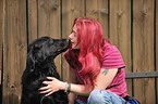 woman with Flat Coated Retriever