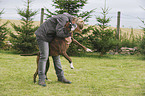 woman and German Boxer