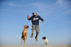 man and 2 dogs