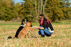 woman and 2 dogs