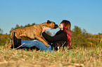 woman and German Boxer