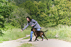 woman and German Boxer