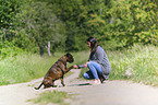 woman and German Boxer