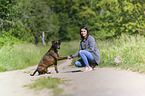 woman and German Boxer