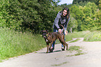 woman and German Boxer