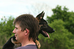 man and German Shepherd