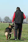 man and German Shepherd