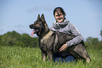 woman and GDR Shepherd