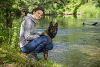 woman and GDR Shepherd