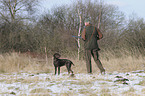 huntsman with German shorthaired Pointer