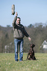 man and German shorthaired Pointer