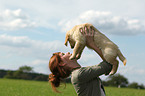 woman with Golden Retriever Puppy