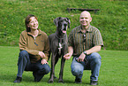 man and woman with great dane