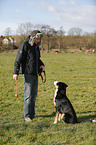 man and Greater Swiss Mountain Dog