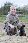 boy with Hollandse Herder Puppies