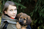 girl with Hovawart Puppy