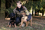 girl with Hovawart Puppies
