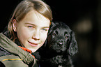 girl with Hovawart Puppy