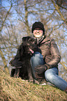 woman and Labradoodle