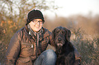 woman and Labradoodle