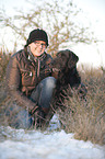 woman and Labradoodle