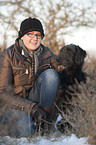 woman and Labradoodle