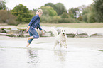 woman and Labradoodle
