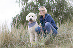 woman and Labradoodle